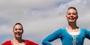 Macey Bennett and Sian Roach,highland dancers in the Royal Edinburgh Military Tattoo on the tarmac at Brisbane International Airport,February 6,2026.