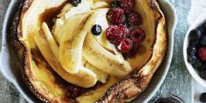 Dutch baby with bananas and berries.