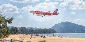 An AirAsia flight comes in for a landing at Phuket Airport.