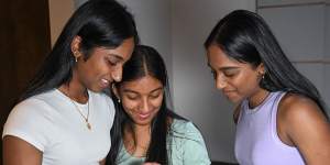 Identical triplets Suruthi,Swathi and Surabhi Tharmaseelan viewing their VCE results on Monday morning.
