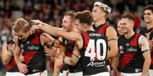 Darcy Parish (left) is congratulated after winning the Anzac Medal this year.