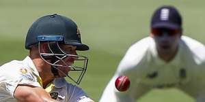 David Warner looks to play a shot outside off stump on day two at the Gabba.