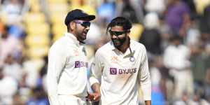 Ravindra Jadeja,right,celebrates with captain Rohit Sharma after taking the wicket of Todd Murphy.