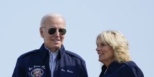President Joe Biden and first lady Jill Biden stand at the top of steps of Air Force One before boarding at Andrews Air Force Base on Saturday,as they head to London.
