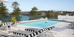 Rooftop pool and beach beyond.