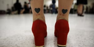 The legs of a model tattooed with hearts as she prepares backstage before a presentation as part of Fashion Weekend Plus Size Summer 2015 collection show in Sao Paulo July 25,2015. REUTERS/Nacho Doce