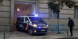 A Spanish National Police van,believed to be carrying Catalonian politicians and activists,arrives at the Spanish Supreme Court in Madrid on Wednesday.
