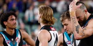 Charlie Dixon of the Power looks dejected after their loss against Geelong.