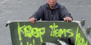 A collector returning cans and bottles for recycling in Sydney.
