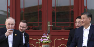 Russian President Vladimir Putin,and Chinese President Xi Jinping attend an informal meeting in Beijing,China.