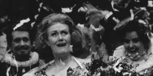 Dame Joan Sutherland covered in streamers during her final bow after her last performance at the Opera House in 1990. 