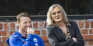 Dani Laidley (right) with former North Melbourne player Brent Harvey at a club function last year.