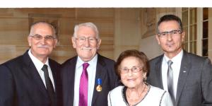Eddie Jaku received his OAM in 2013 with sons Andre and Michael and wife Flore.