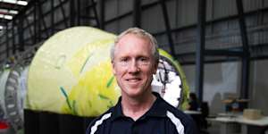 Adam Gilmour,CEO of Gilmour Space,is photographed next to the test vehicle they intend of launching this year at the company’s facility on the Gold Coast.