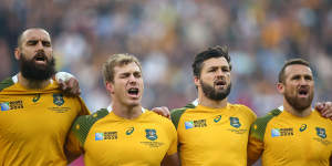 Went off injured:Matt Giteau,right,pictured singing the national anthem at the start of the match with try-scoring hero Adam Ashley-Cooper.