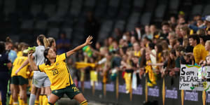 Sam Kerr throws her boots into the crowd after the Matildas faced Brazil last month. She’ll be back in Sydney next week for their friendly series against the USA.