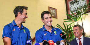 Mitchell Starc and Pat Cummins with Mike Baird.