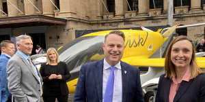 Lord Mayor Adrian Schrinner and Wisk regional director Catherine MacGowan with a fifth generation self-flying air taxi. The company hopes to have an updated model flying over Brisbane before the 2032 Games.