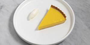 The lemon tart is so gently set,it hovers between liquid and solid.