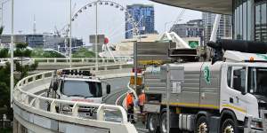 Garden debris from the Queen’s Wharf precinct washed into drains along the Margaret Street off-ramp,forcing road closures.