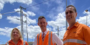 Queensland Rail chief executive Kat Stapleton,Transport Minister Mark Bailey and Cross River Rail project director Jeremy Kruger inspect the expanded Mayne train holding yards.
