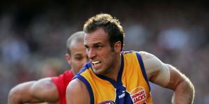 On the run:Chris Judd with West Coast.