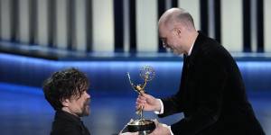 Peter Dinklage,left,presents the award for outstanding drama series to creator Jesse Armstrong.