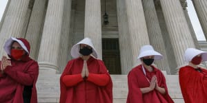 Protesters in Washington are dressed as characters from Margaret Atwood’s The Handmaid’s Tale. The book’s depiction of an oppressive dystopia has become a popular symbol among rights campaigners. 