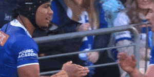Stephen Crichton’s personal handshake with Bulldogs prop Max King.