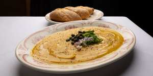 Billed as a Santorini specialty,fava (broad bean dip) is served warm,with bread for dunking.