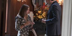 ‘Ludicrously capacious’ … Francesca Root-Dodson and Nicholas Braun in a scene from Succession featuring the most infamous handbag of the year.