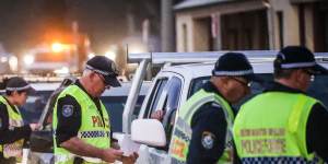 NSW Police stop and question drivers at a checkpoint on the NSW-Victoria border in Albury last year.