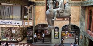This mischievous statue is the work of Czech artist David Cerny.