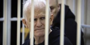 Ales Bialiatski,the head of Belarusian Vyasna rights group,sits in a defendants’ cage during a court session in January.