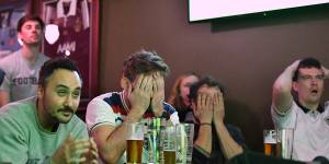 England fans at the Turf Sports Bar despair at their team’s loss. 