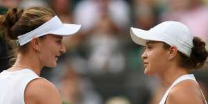 Barbora Krejcikova and Ash Barty shake hands at the net after their fourth-round match.