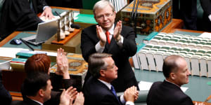 Kevin Rudd applauds members of the stolen generation in the public gallery at Parliament House after delivering his apology in 2008. 