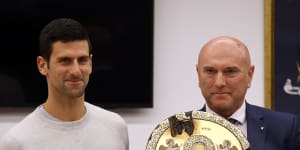Serbian tennis player Novak Djokovic,left,poses with top local official Marko Carevic during a ceremony in the municipal building in Budva,Montenegro.