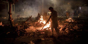 A crematorium in New Delhi on Thursday where multiple funeral pyres burn for victims of COVID-19.