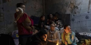 A family huddled in a bomb shelter in Mariupol on March 6.