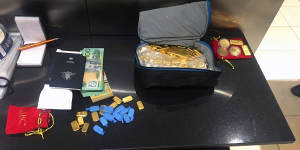 Gold bullion,luxury cars and cash seized in alleged $10 million NDIS scam