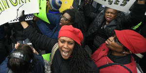 Duelling protesters clash last week over the decision to drop charges against Smollett. 