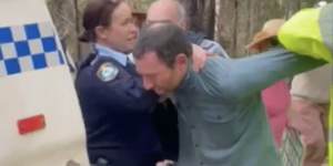 A still from a vidoe of Graham being arrested at a protest.
