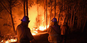 NSW RFS fire fighters work through the night to prevent a flare up from crossing the Kings Highway in between Nelligen and Batemans Bay. NSW RFS has called for all tourists to leave the area ahead of this weekend’s hazardous fire conditions. Batemans Bay,NSW. 2nd January,2020. 
