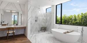 The bathroom includes marble accents.