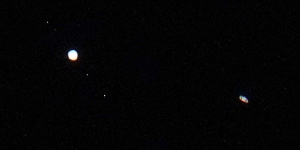 Jupiter,and three of its moons (left) and Saturn (right) are seen above Chicago on December 22,2020. The two planets were then in their closest observable alignment since 1226.