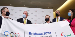 Brisbane Lord Mayor Adrian Schrinner,Federal Sports Minister Richard Colbeck,AOC president John Coates,Olympian James Tomkins and Queensland Premier Annastacia Palaszczuk celebrate in Tokyo.