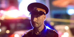 Police work the scene of a shooting in Toronto.