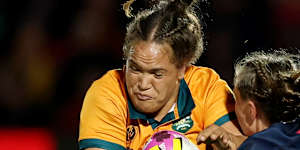 Australia’s Ashley Marsters takes the ball up during the match.