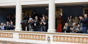Visitors applaud after the landmark vote on the same-sex marriage bill in parliament in Athens.